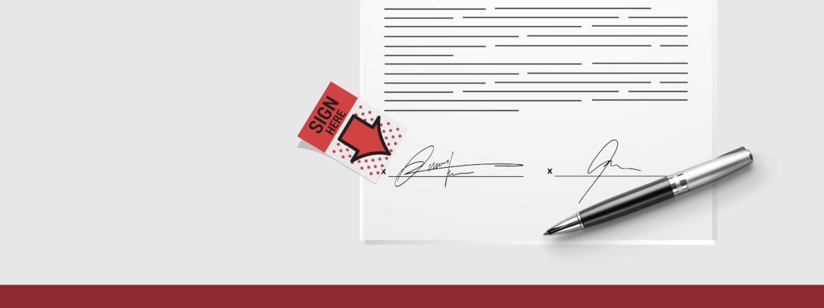 Paper with two signatures in it. A black pen.